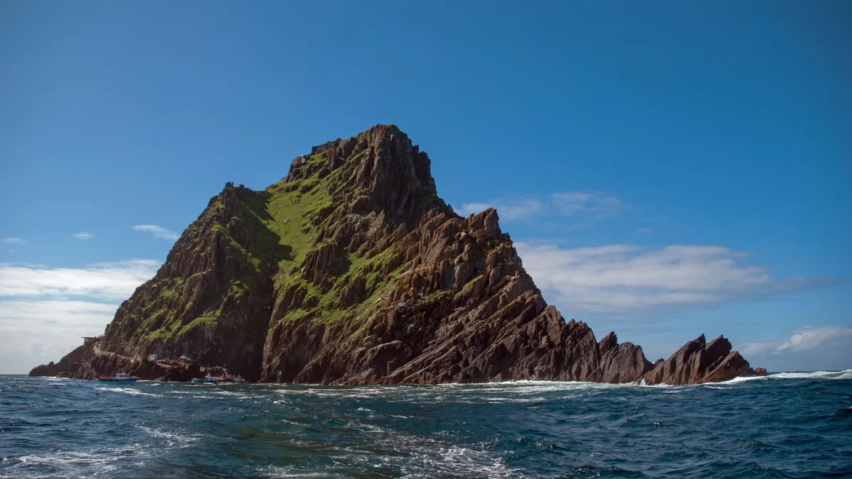 Skellig Michael rising out of the Atlantic under a clear sky