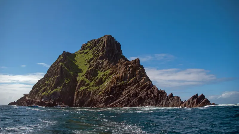 Skellig Michael rising out of the Atlantic under a clear sky