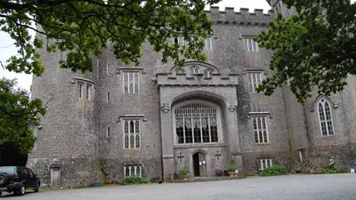 The battlemented front and arched doorway of Charleville Castle