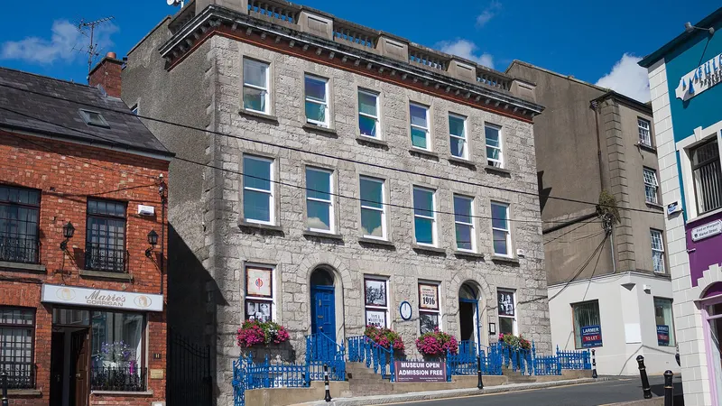 The brick and stone front of Monaghan County Museum on the street