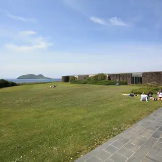 The lawn and terrace at the Blasket Centre with the islands out beyond