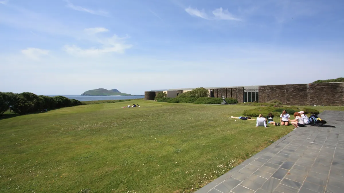 The lawn and terrace at the Blasket Centre with the islands out beyond