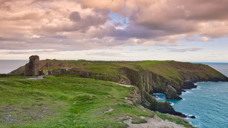 Cliffs and a stone ruin on a headland near Kinsale at sunset