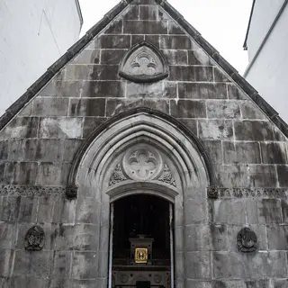 The carved stone front and pointed doorway of the Costello Memorial Chapel in Carrick-on-Shannon