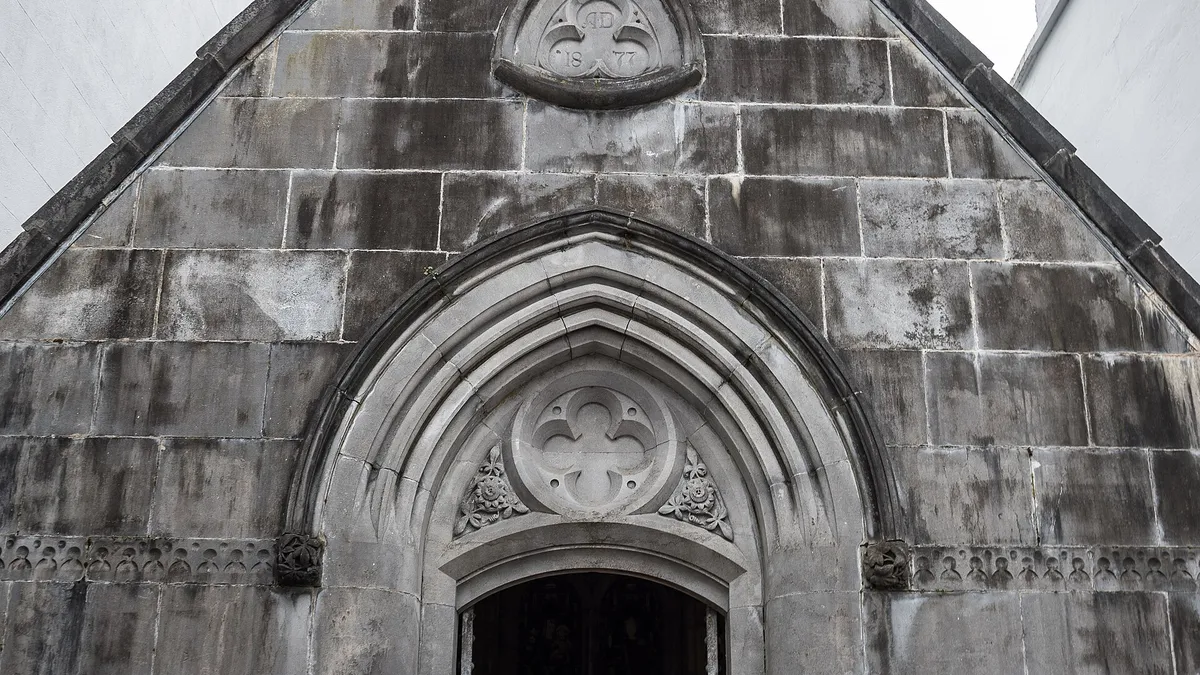 The carved stone front and pointed doorway of the Costello Memorial Chapel in Carrick-on-Shannon