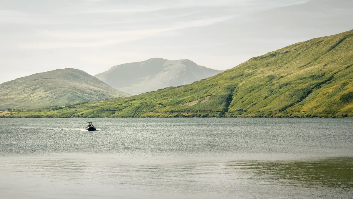 Mountains standing over the water at Leenane in County Galway