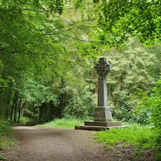 A stone cross beside the woodland path at Curraghchase Forest Park