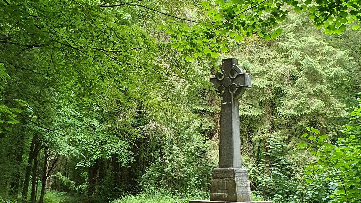 A stone cross beside the woodland path at Curraghchase Forest Park