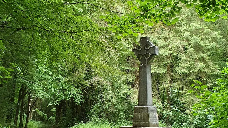 A stone cross beside the woodland path at Curraghchase Forest Park