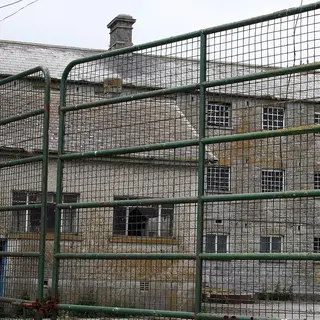 The stone workhouse building at Donaghmore behind its gates, County Laois