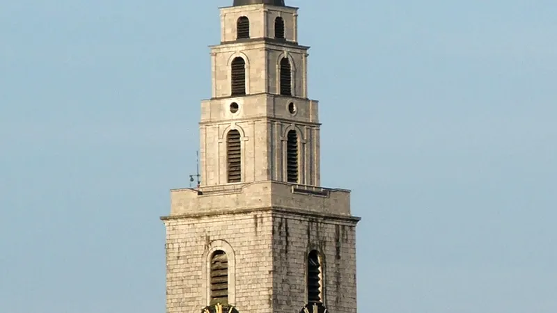 The clock tower and weathervane of Shandon above the rooftops of Cork city