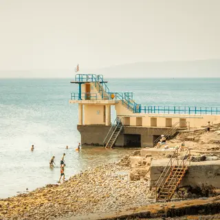 People on the diving board at the end of Salthill promenade