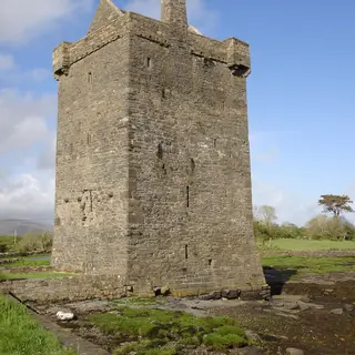 The square tower of Rockfleet Castle standing on the shore of Clew Bay