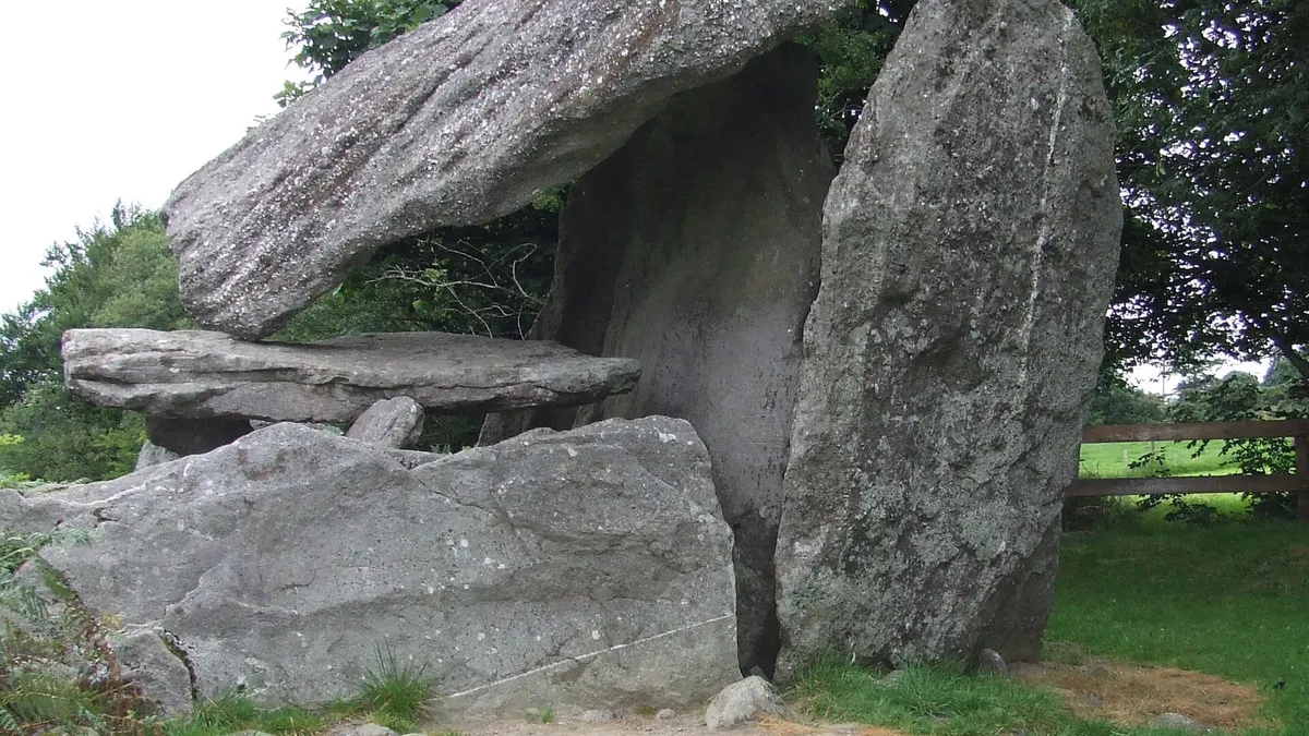 The long capstone of Kilmogue Portal Tomb leaning back on its uprights