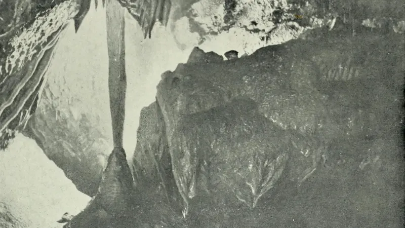 A tall stone column formation inside Mitchelstown Cave, County Tipperary