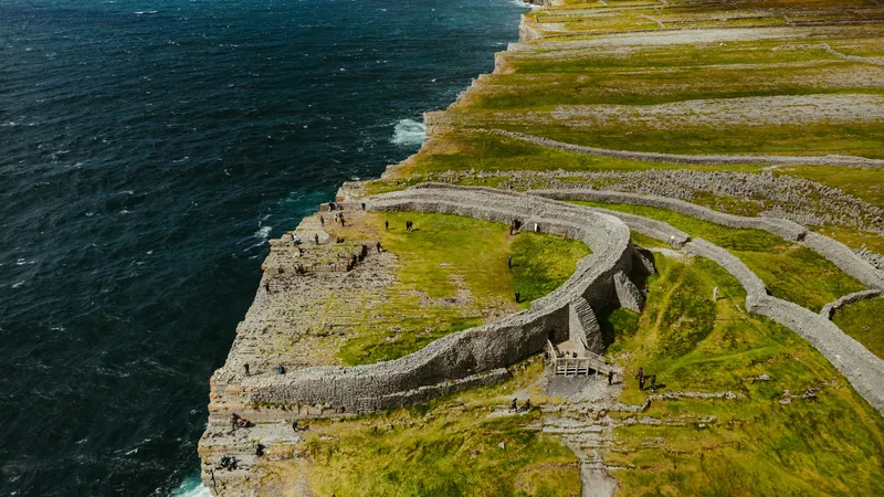 The stone ramparts of Dun Aonghasa on the cliff edge, from the air