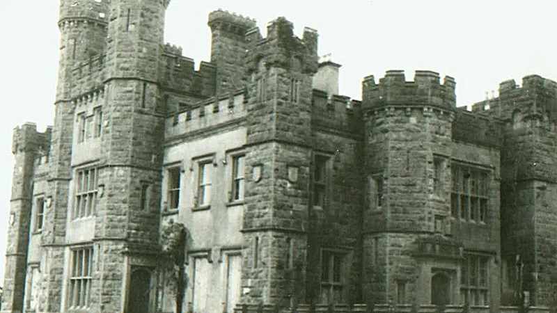 The castellated front of Castle Saunderson in an old black and white photograph