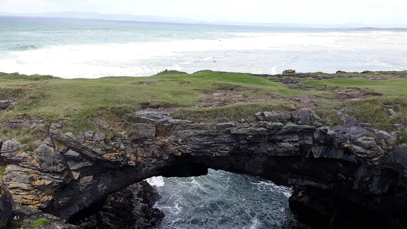 Sea arches cut into the rock at the Fairy Bridges outside Bundoran