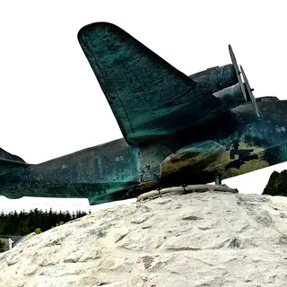 A bronze flying boat mounted on a stone plinth outside the museum at Foynes