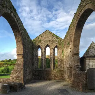 The nave of the church in Baltinglass Abbey, showing the archways either side. The pyramidal tomb of the Stratford family can be seen at right