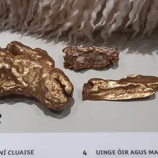 Bronze age gold ornaments in a case at the National Museum of Ireland on Kildare Street
