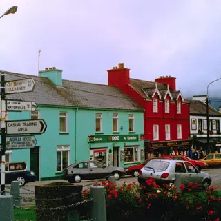 Coloured shopfronts along the street in Sneem