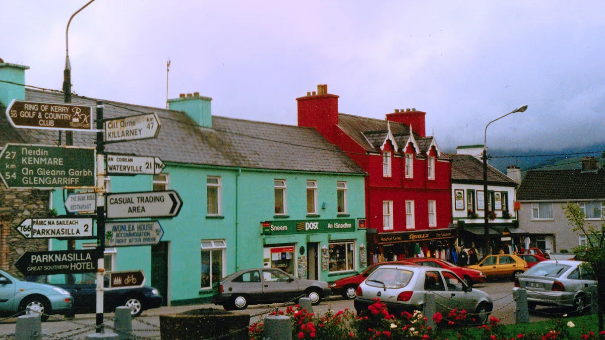 Coloured shopfronts along the street in Sneem