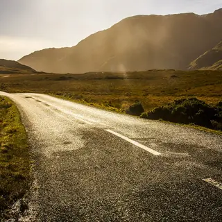The road running through the Doolough valley under the mountains, County Mayo