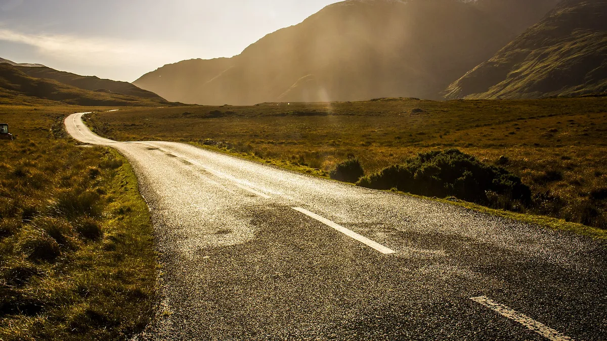 The road running through the Doolough valley under the mountains, County Mayo