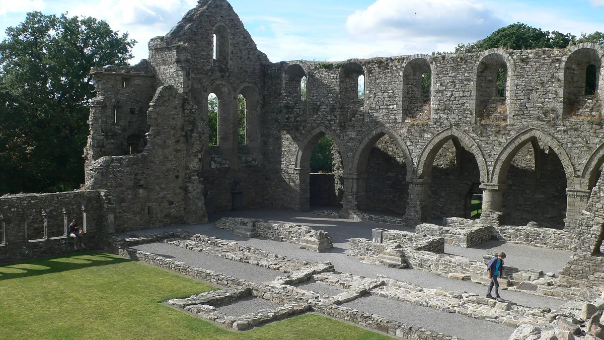 The arcaded nave of Jerpoint Abbey with the cloister garth in front of it